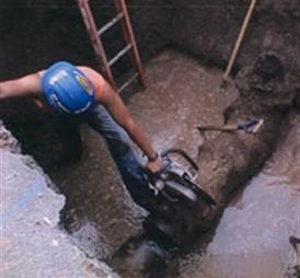Worker fixing water pipe