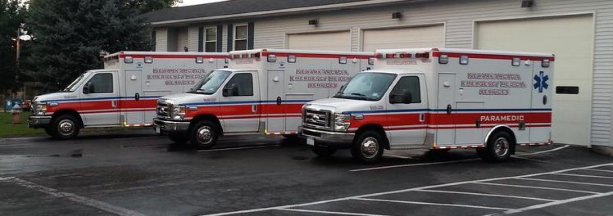 3 ambulances parked outdoors