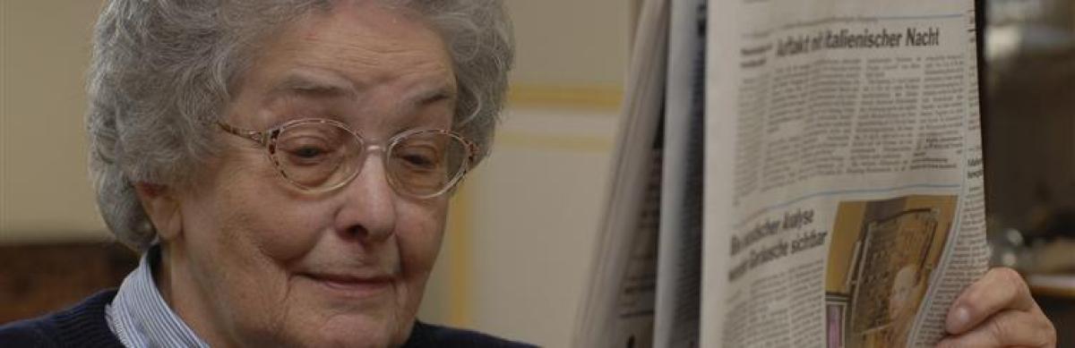 Elderly woman reading